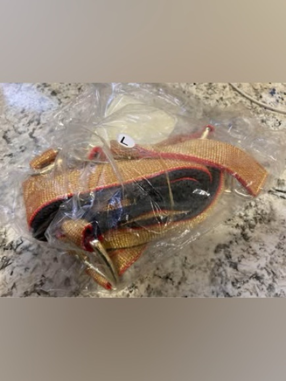 Brand new in package - never opened. Large horse halter. Gold and red.